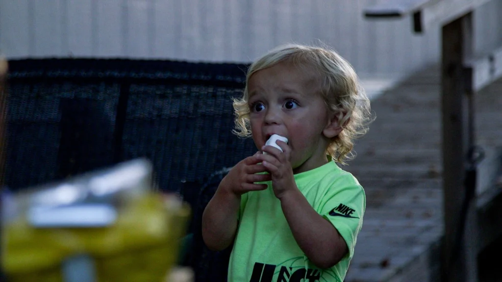 A youngster eats a toasted marshmallow at an RJourney RV Resort.