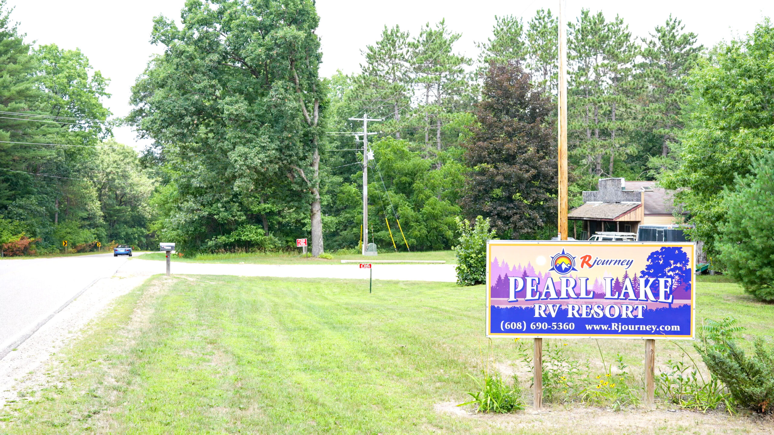 A sign welcomes visitors to Pearl Lake RV Resort and Campground in Redgranite, WI