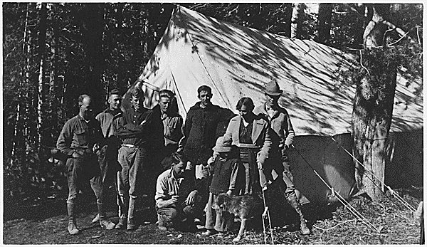 A group of men who work as road construction crew pose for a black and white picture.