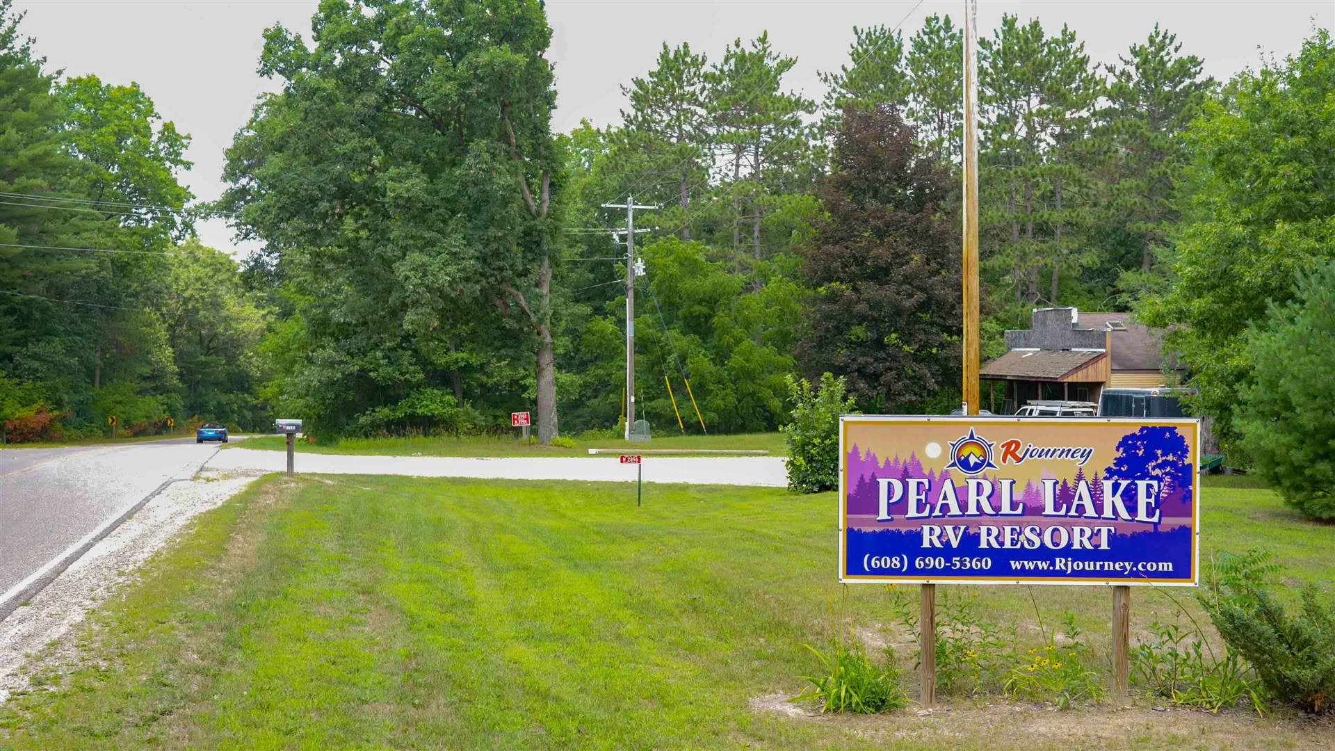 Full hookup RV sites under red pines at Pearl Lake RV Campground in Redgranite, Wisconsin