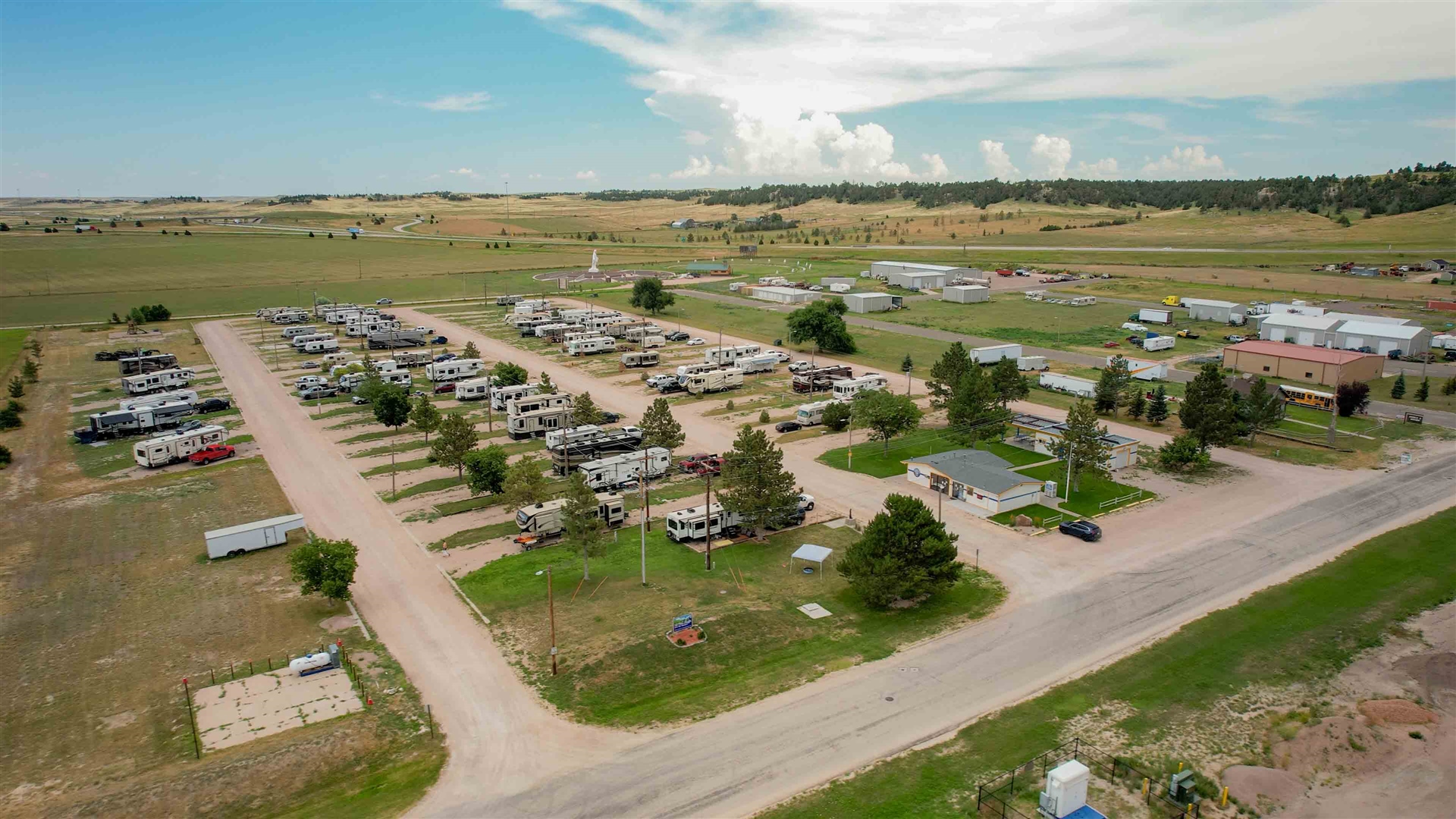 Full-hookup back-in RV sites with picnic tables at Pine Bluffs RV Park by RJourney