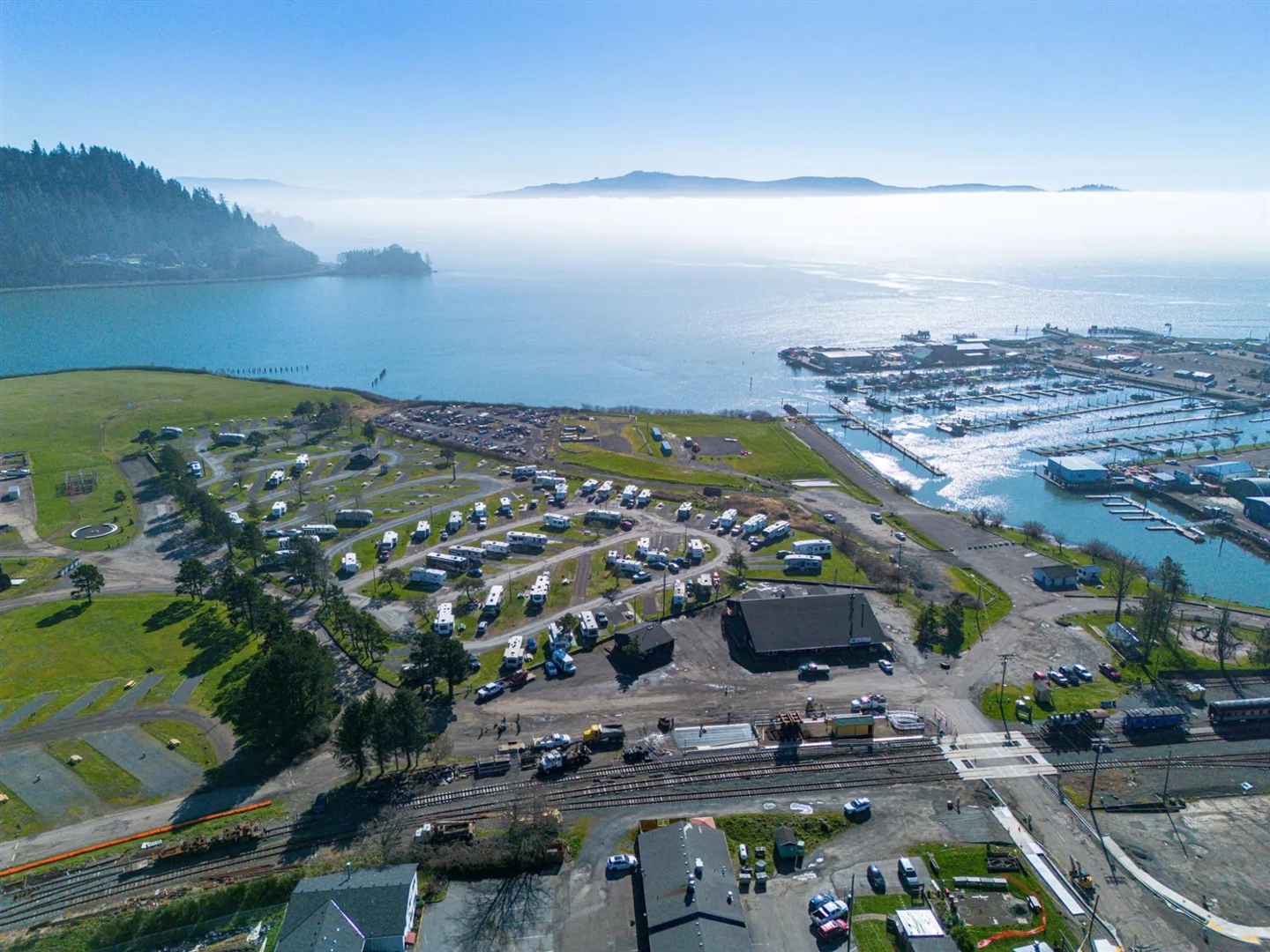 Roam Tillamook RV Resort aerial view showing RV sites along Tillamook Bay waterfront