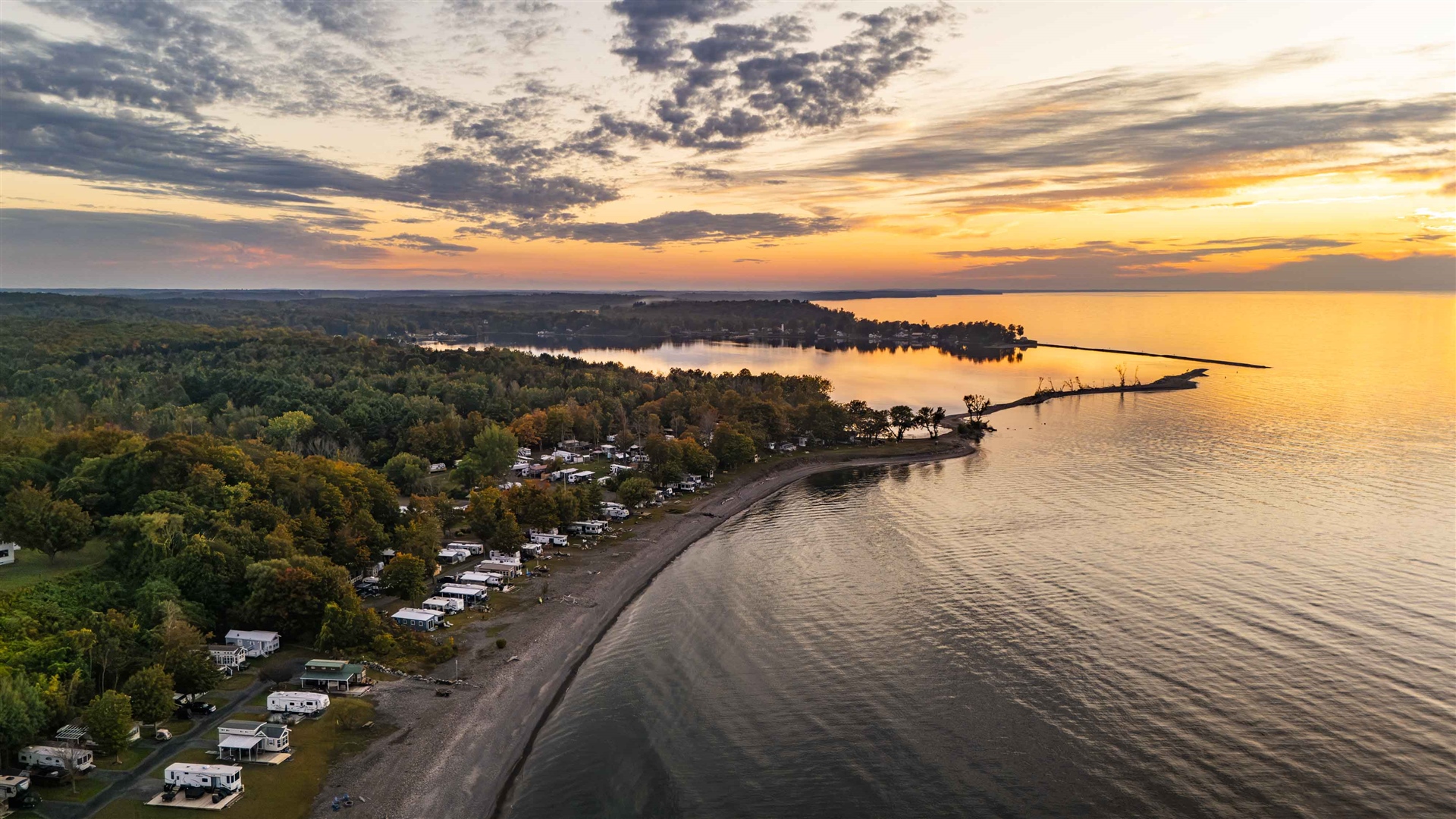 Shaded waterfront RV camping sites at Shady Shores RV Resort & Campground in Fair Haven, New York