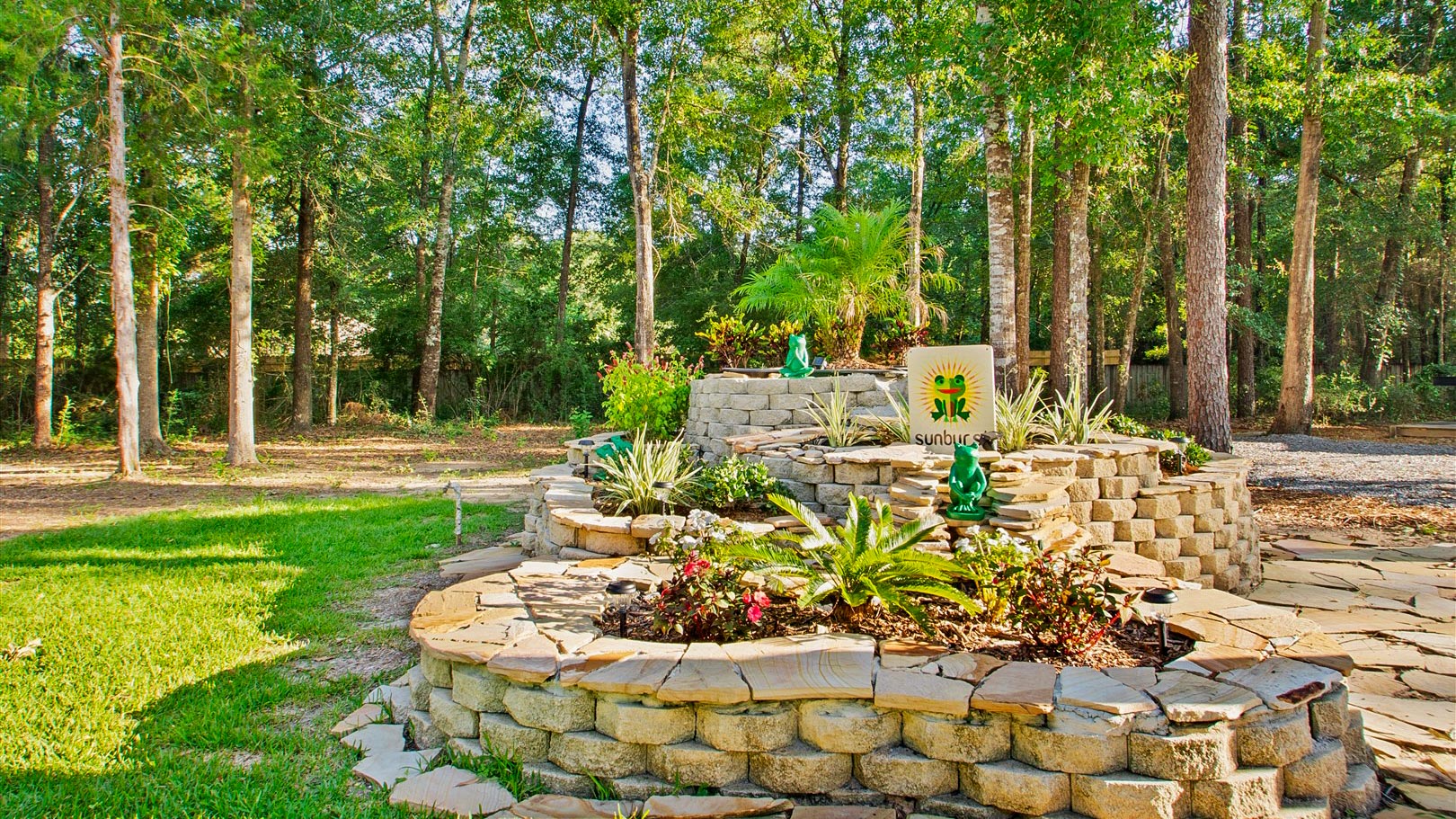 Garden and landscaped grounds at Sunburst RV Resort in Milton, Florida